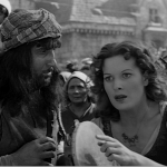 Esmeralda spots an eyes staring Maureen O'Hara 1939 Hunchback of Notre Dame picture image