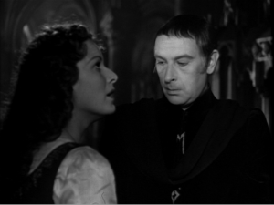 Frollo stares Esmeralda's breasts for 15 seconds Maureen O'hara Sir cedric hardwicke 1939 Hunchback of Notre dame picture image