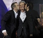 Garou and Patrick Fiori giving Daniel Lavoie a Kiss in Bercy during the Notre Dame de Paris Concert picture image 