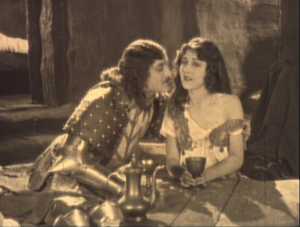 Phoebus (Norman Kerry) revealing Esmeralda's bare shoulder (Patsy Ruth Miller) 1923 Hunchback of Notre Dame image picture