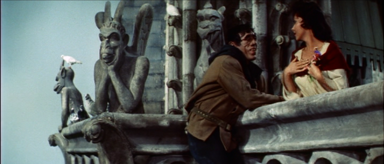 Quasimodo (Anthony Quinn) giving flowers to Esmeralda (Gina Lollobrigida) 1956 The Hunchback of Notre Dame picture image