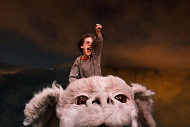 Barret Oliver as Bastian and Falkor The Neverending Story picture image