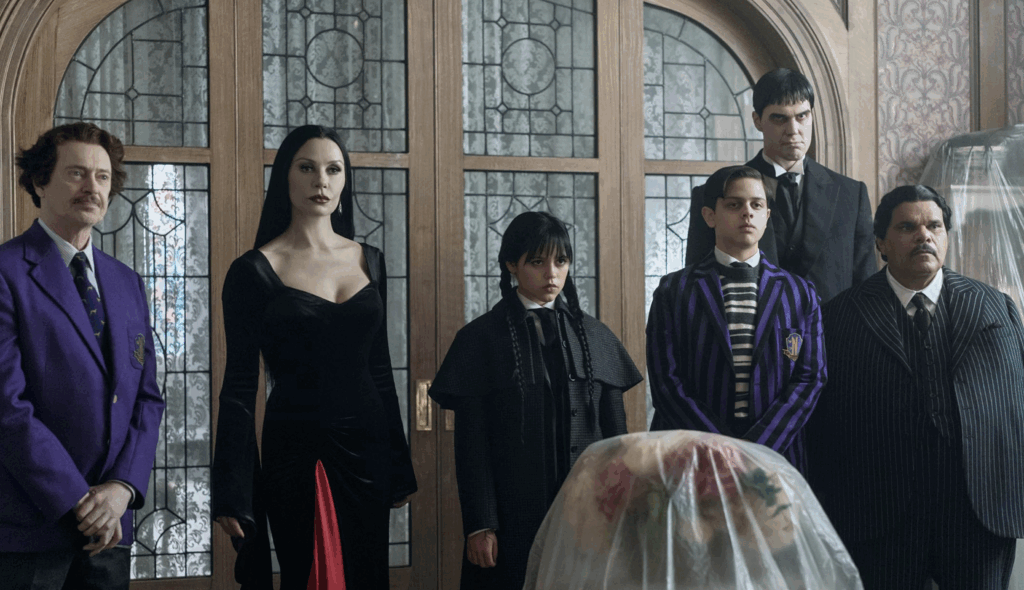 Steve Buscemi as Principle Barry Dort, Catherine Zeta-Jones as Morticia Jenna Ortega as Wednesday, Isaac Ordonez as Pugsley, Joonas Suotamo as Lurch & Luis Gumán as Gomez (Netflix Series Season 2 2025, Season 2 Episode 1)