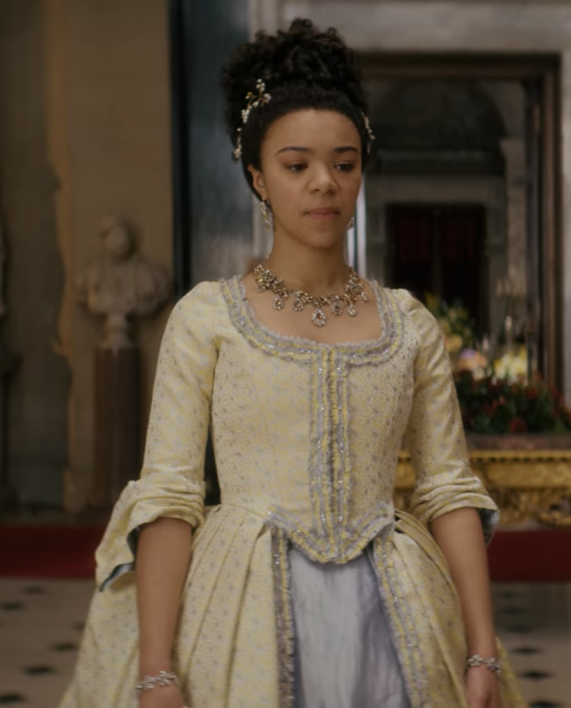 India Amarteifio as young Queen Charlotte in Netflix's “Queen Charlotte: A Bridgerton Story” The Yellow & Gray Gown