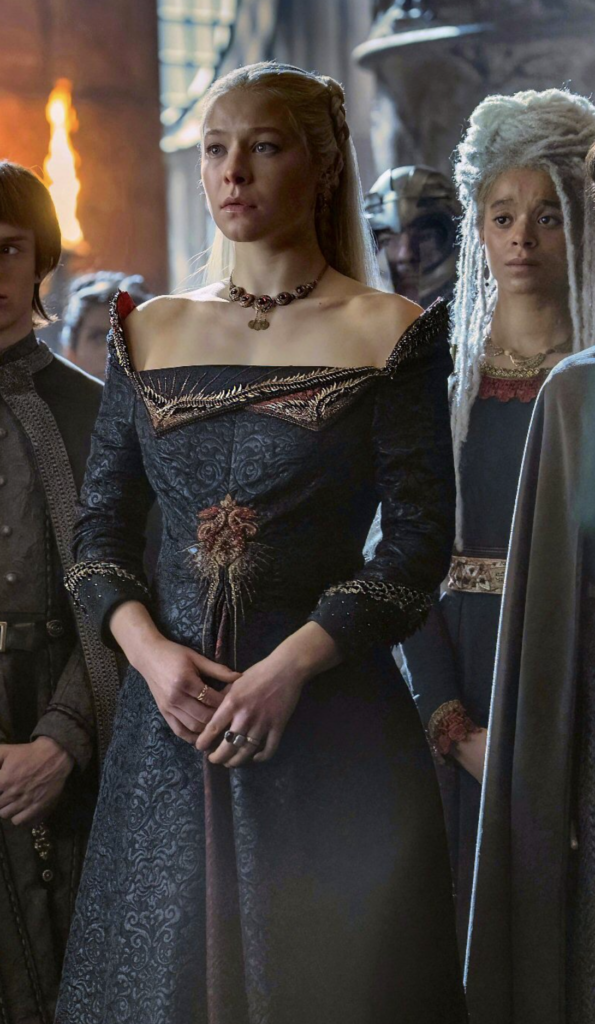 Rhaenyra Targaryen wearing The Dragon Gown in Season 1 of "House of the Dragon" Ranking Rhaenyra Costumes, Dresses, & Outfits
