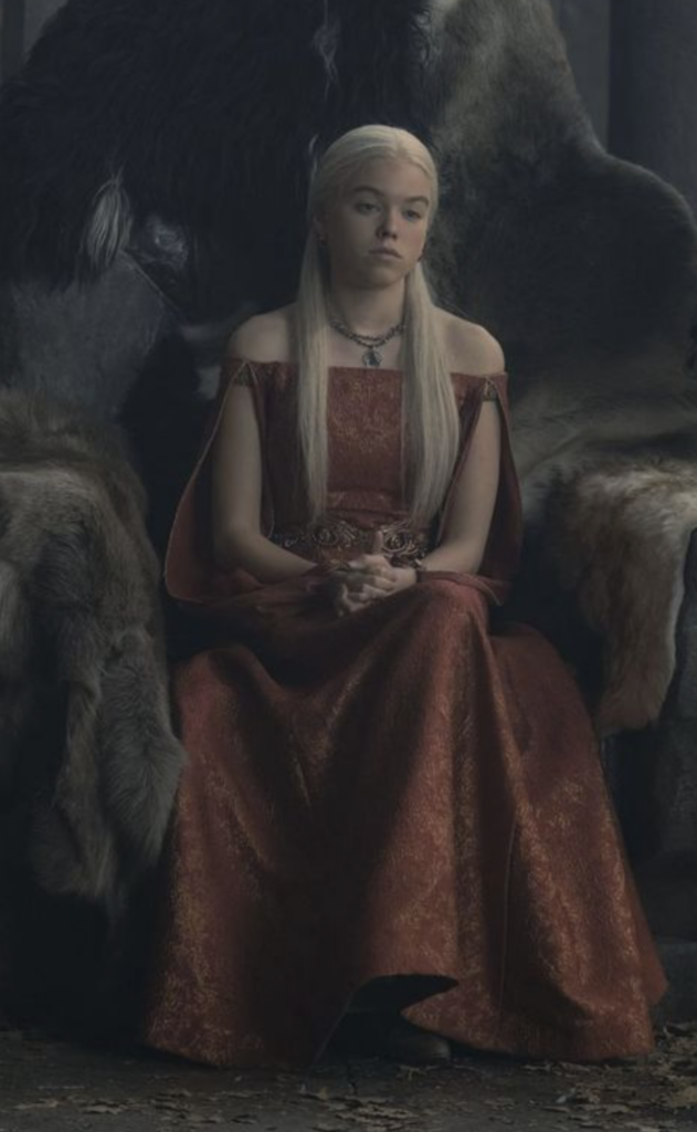 Rhaenyra Targaryen wearing The Red Courting Gown in Season 1 of "House of the Dragon" Ranking Rhaenyra Costumes, Dresses, & Outfits
