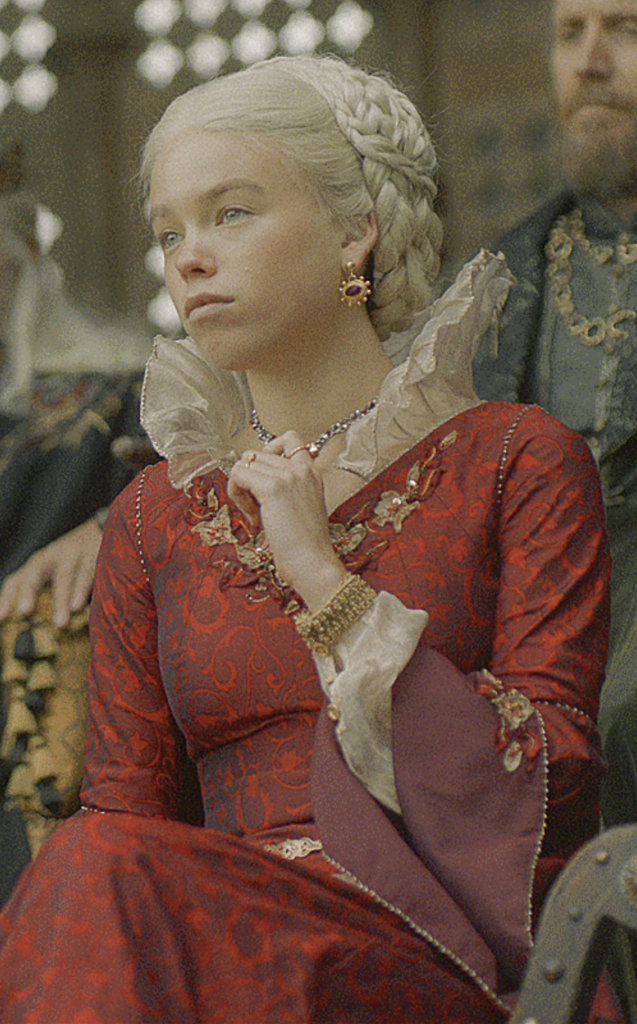 Rhaenyra Targaryen wearing The Red Tourney Gown in Season 1 of "House of the Dragon" Ranking Rhaenyra Costumes, Dresses, & Outfits