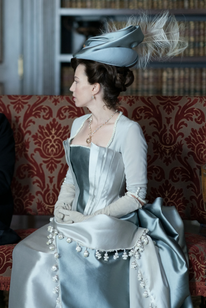 Carrie Coon as Bertha Russell, "The Gilded Age" Season 1 Ranking costumes, gowns, and outfits,T he Moving-In Outfit