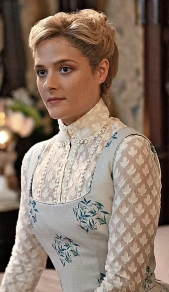 Louisa Jacobson as Marian Brook "The Gilded Age" Season 1 Ranking costumes, gowns, dresses and outfits, The Blue Floral Pinafore Dress