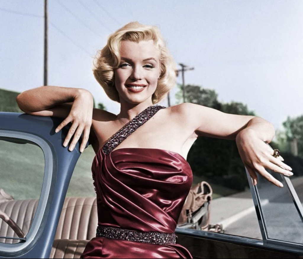 Marilyn Monroe as Pola from How to Marry a Millionaire (1953) in her glamorous gown, Best Burgundy & Dark Red Costumes, Gowns, & Dresses from Modern Set Movies