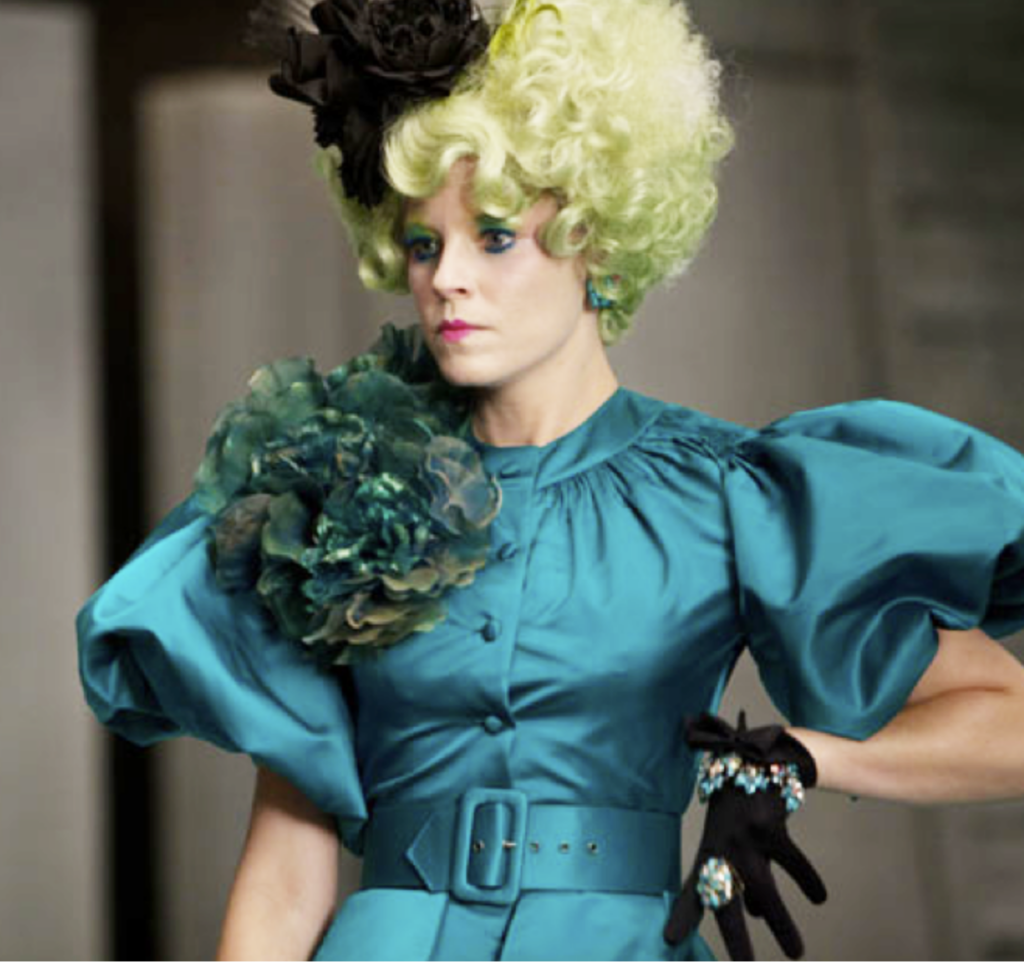 Elizabeth Banks as Effie, Hunger Games (2012) Best Blue-Green (Teal, Turquoise, Aqua, Cyan) Costume, Gowns, & Dresses from Fantasy & Sci-fi Movies