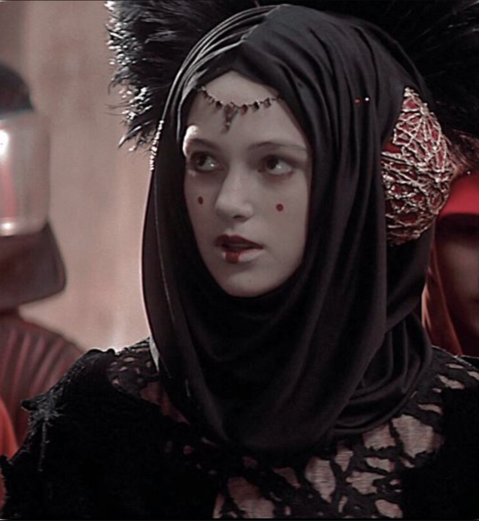 Keira Knightley as Sabé in The Black Traveling Gown, "Star Wars: Episode I – The Phantom Menace" (1999) Best Black Costumes, Gowns, & Dresses from Fantasy & Sci-fi Movies