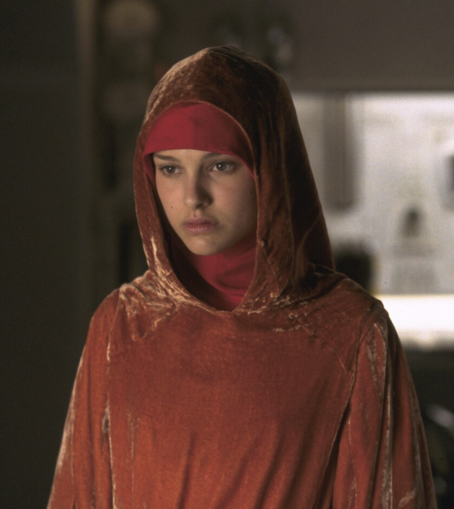 Natalie Portman as Padmé as a handmaiden, "Star Wars Episode I: The Phantom Menace" (1999) Best Orange Costumes, Gowns, & Dresses from Fantasy & Sci-fi Movies